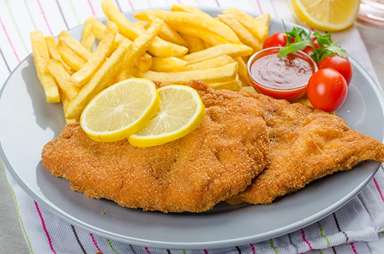 Schnitzel + Pommes/Reis